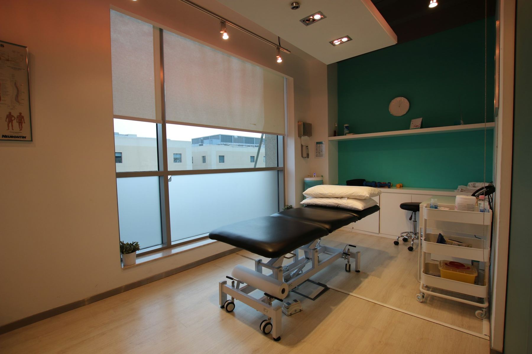 Therapy room with a treatment table for massage and physical therapy